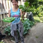 woman holding vegetables veg